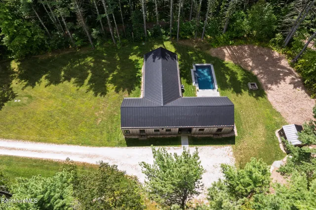 a view of a house that has a small yard