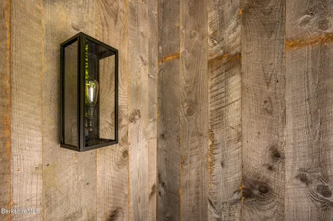 a bathroom with a shower and a mirror
