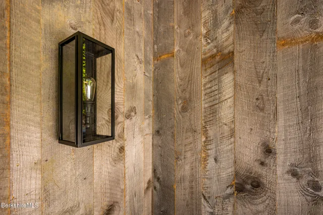 a bathroom with a shower and a mirror