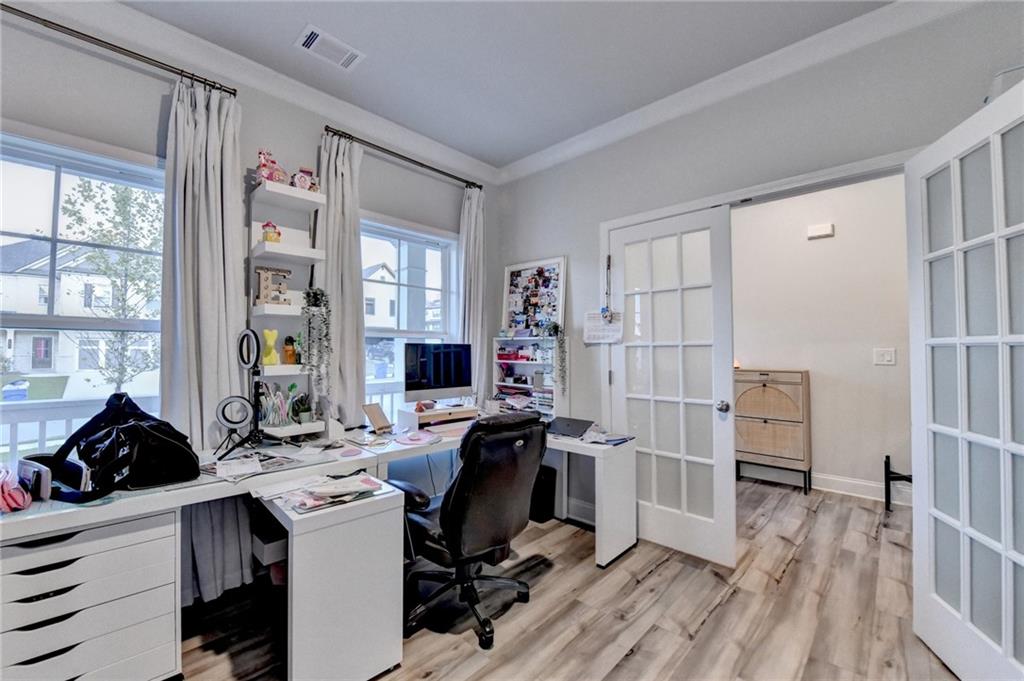 298 Ryston Way Grayson, GA 30017 - Photo 17 of 51 a view of a workspace with furniture and a window