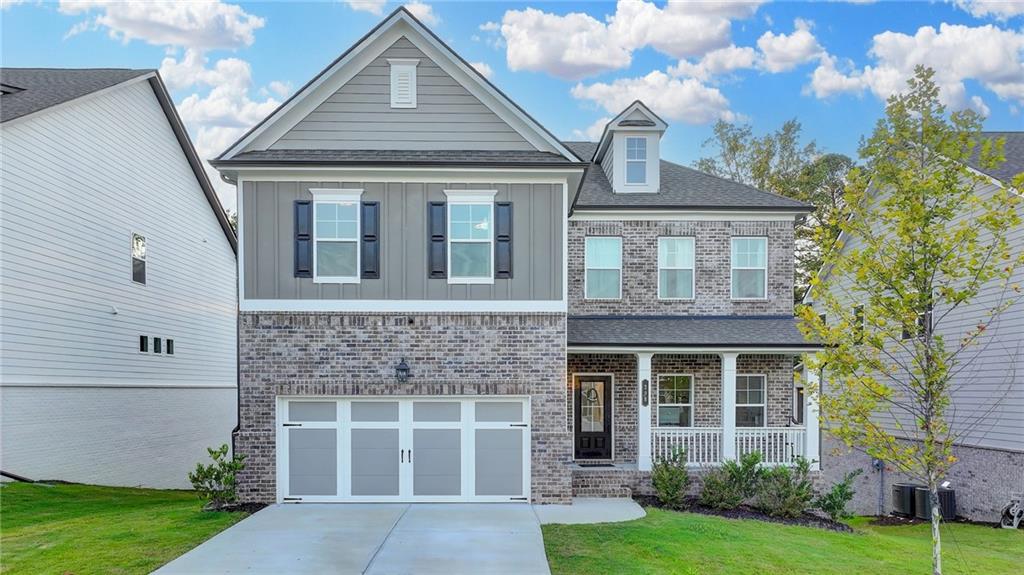 298 Ryston Way Grayson, GA 30017 - Photo 2 of 51 front view of a house with a yard