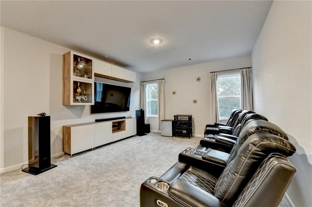298 Ryston Way Grayson, GA 30017 - Photo 21 of 51 a living room with furniture and a flat screen tv