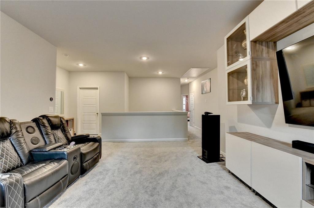 298 Ryston Way Grayson, GA 30017 - Photo 23 of 51 a living room with furniture and a flat screen tv