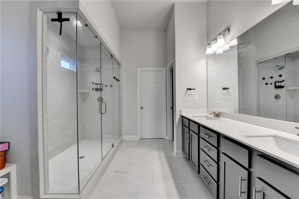 298 Ryston Way Grayson, GA 30017 - Photo 28 of 51 a spacious bathroom with a double vanity sink mirror and shower