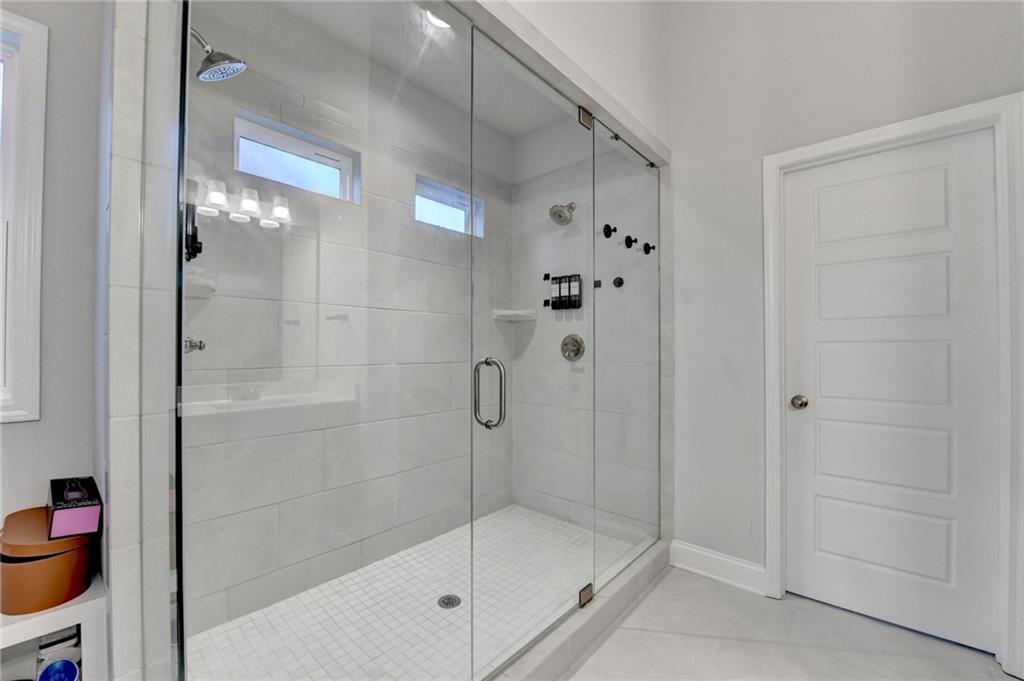 298 Ryston Way Grayson, GA 30017 - Photo 30 of 51 a bathroom with a shower