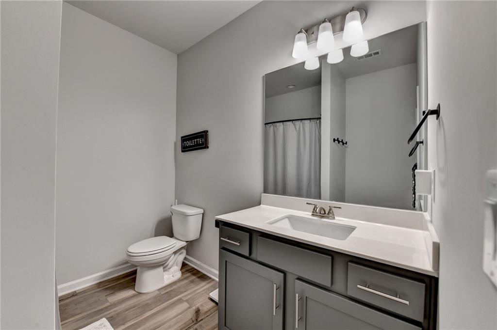298 Ryston Way Grayson, GA 30017 - Photo 33 of 51 a bathroom with a sink toilet and a mirror