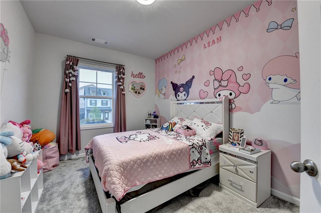 298 Ryston Way Grayson, GA 30017 - Photo 36 of 51 a bedroom with a bed and a window