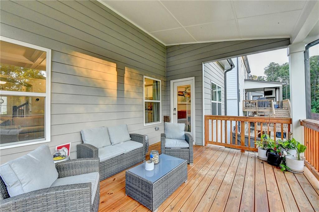 298 Ryston Way Grayson, GA 30017 - Photo 41 of 51 a outdoor living space with patio furniture and wooden floor