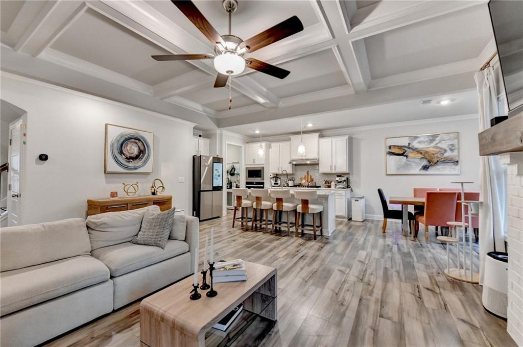 298 Ryston Way Grayson, GA 30017 - Photo 9 of 51 a living room with furniture kitchen view and a wooden floor
