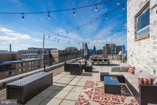 a view of a terrace with furniture