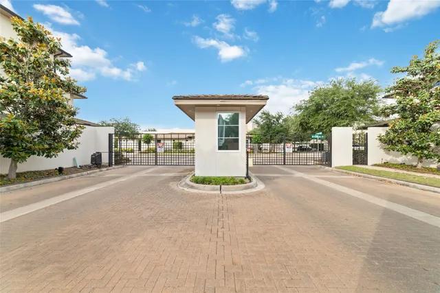 a view of a house with a patio and a garden