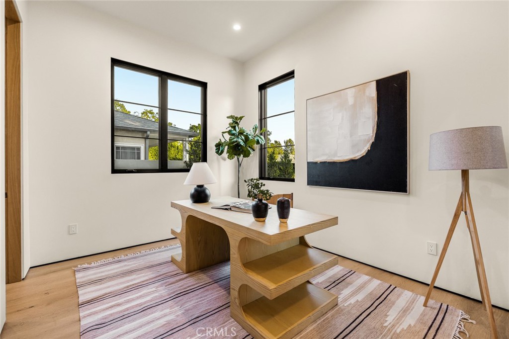 12249 Addison Street Valley Village, CA 91607 - Photo 11 of 60 a living room with a couch and a table