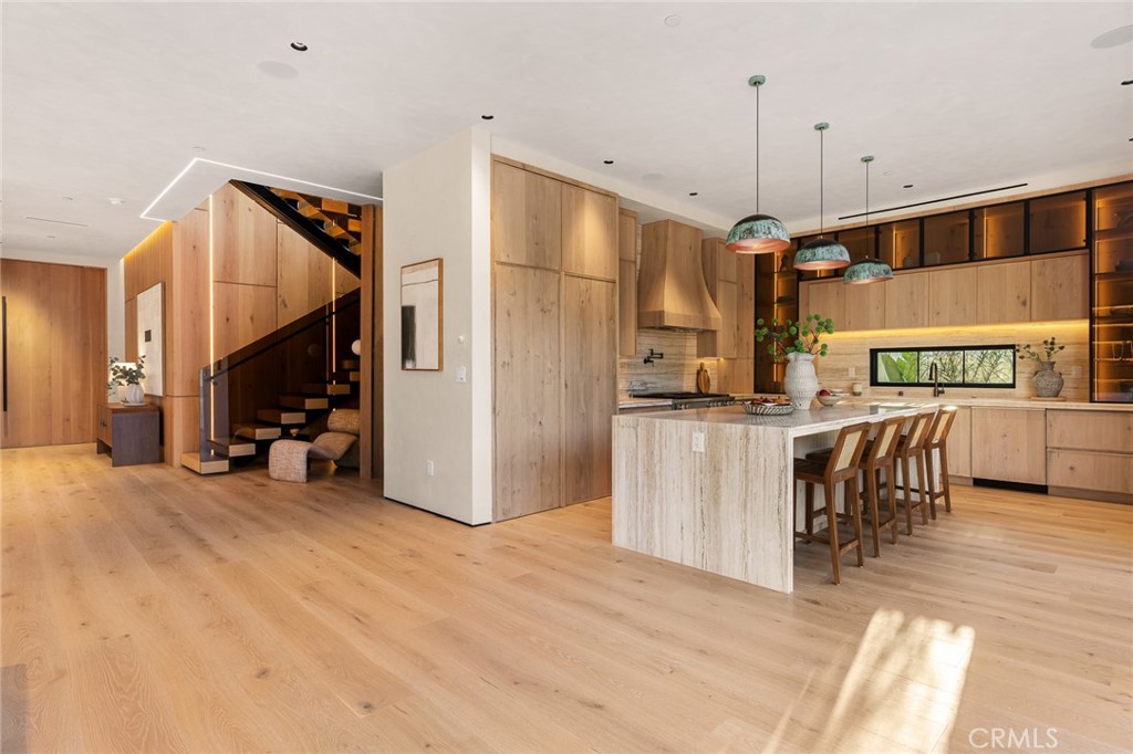 12249 Addison Street Valley Village, CA 91607 - Photo 23 of 60 a view of a kitchen with furniture and a ceiling fan