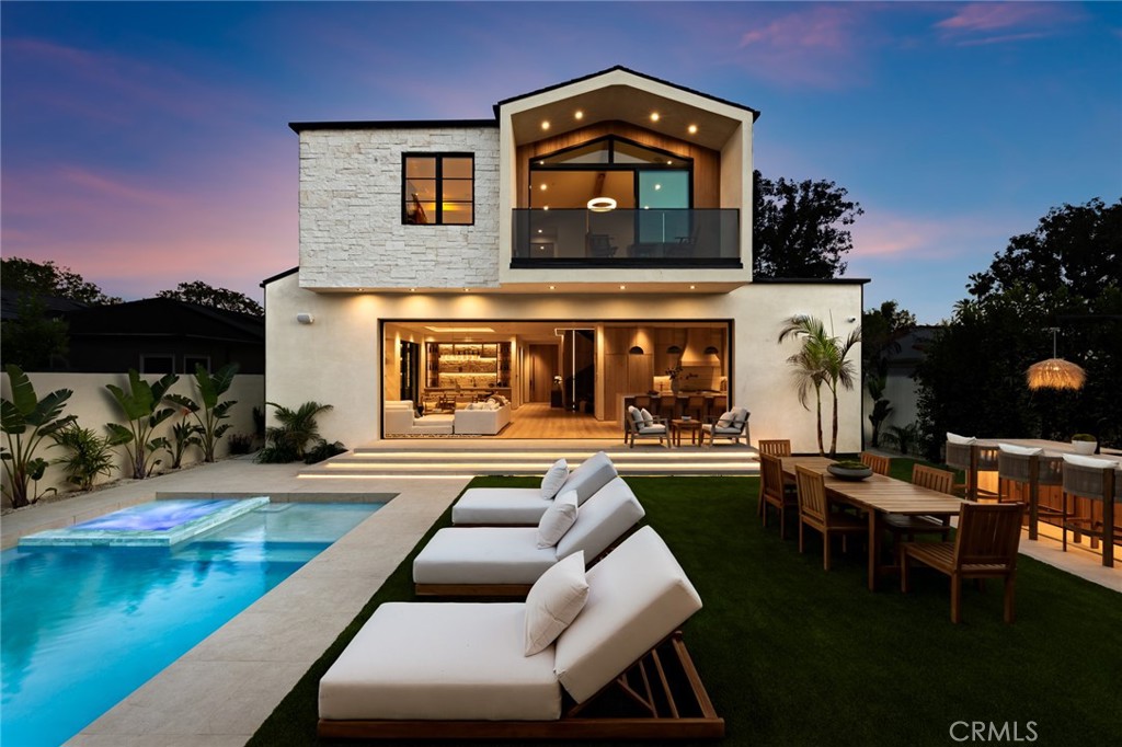 12249 Addison Street Valley Village, CA 91607 - Photo 29 of 60 a view of a house with swimming pool and sitting area