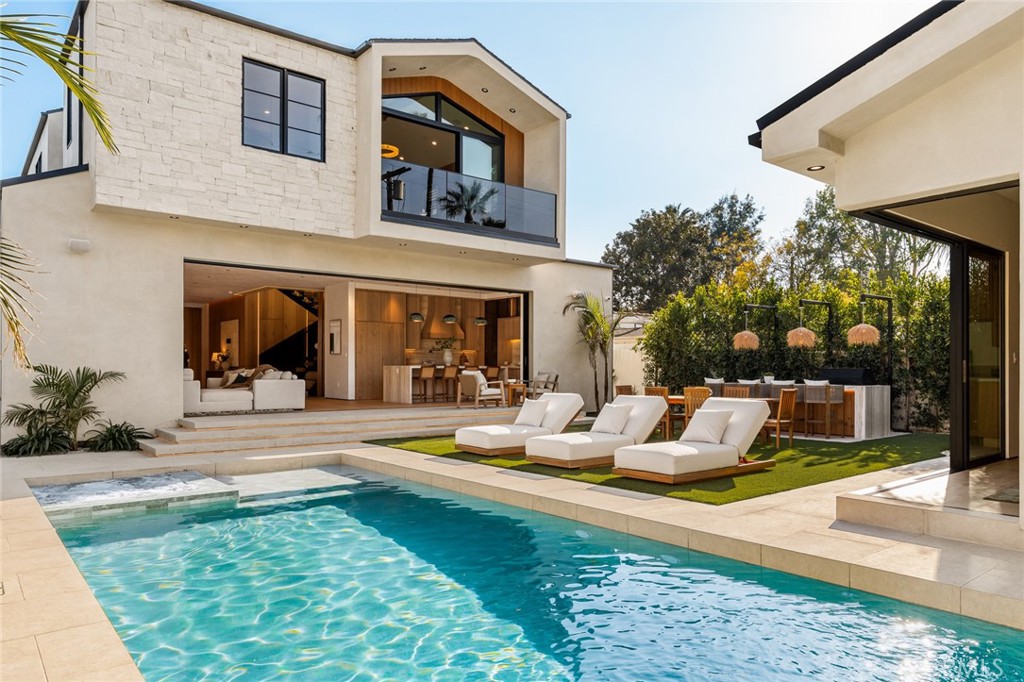 12249 Addison Street Valley Village, CA 91607 - Photo 33 of 60 a view of a house with swimming pool and sitting area