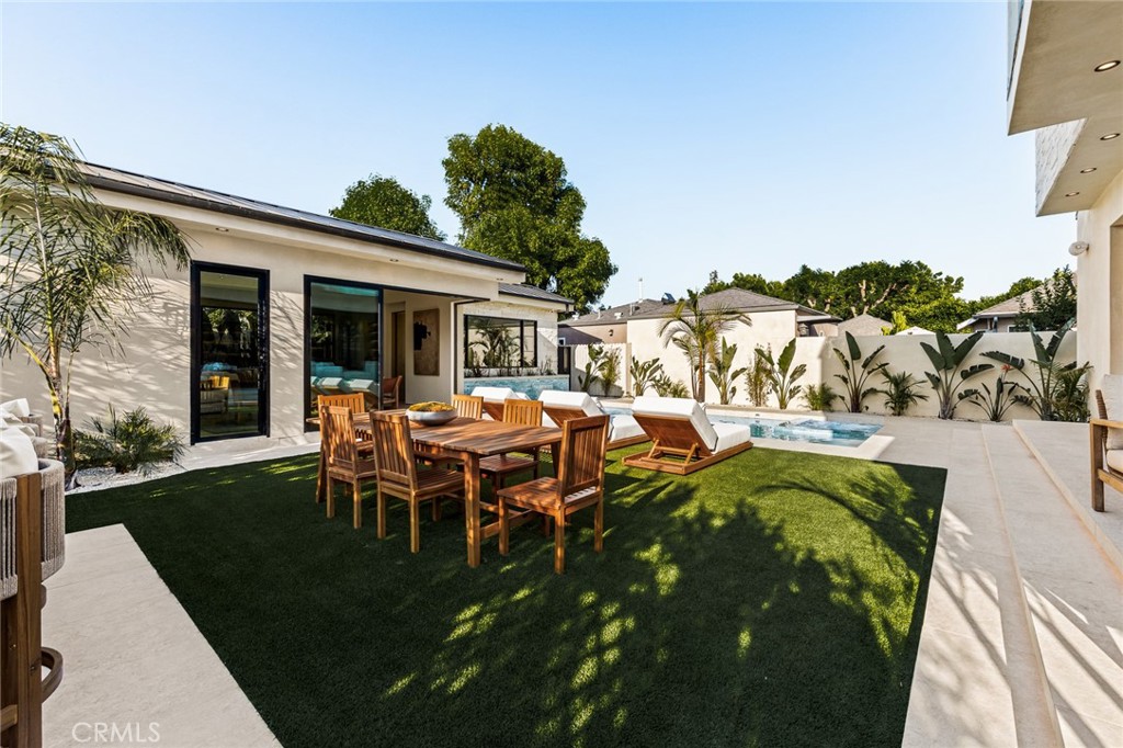 12249 Addison Street Valley Village, CA 91607 - Photo 34 of 60 a view of a outdoor space with table and chairs