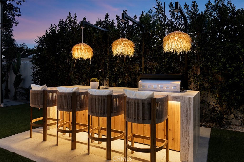 12249 Addison Street Valley Village, CA 91607 - Photo 36 of 60 a view of an chairs and table in the patio