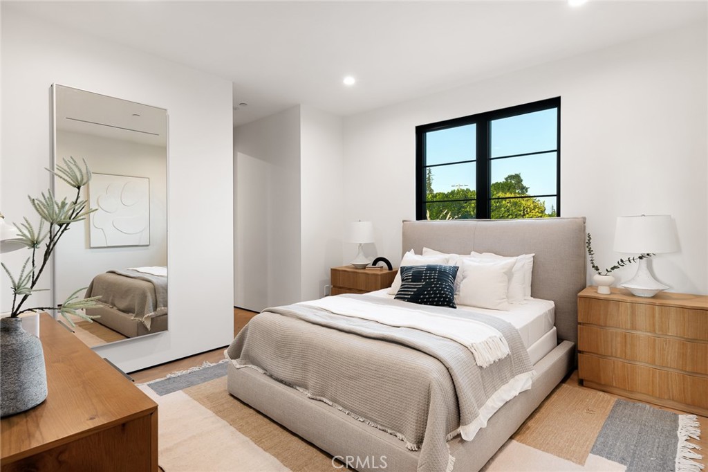 12249 Addison Street Valley Village, CA 91607 - Photo 40 of 60 a bedroom with bed and window