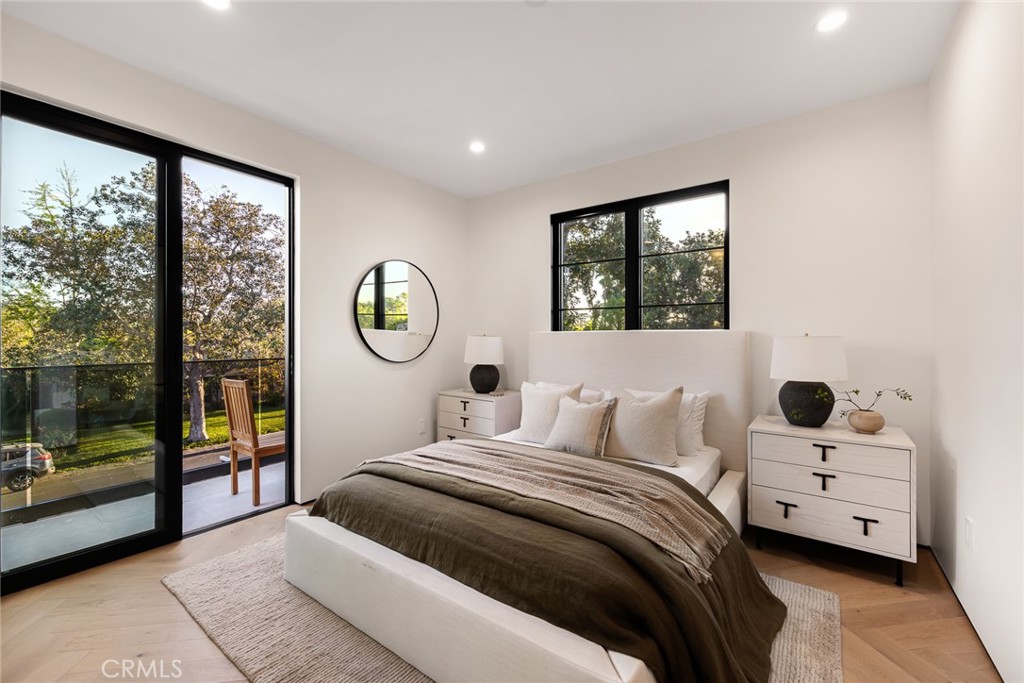 12249 Addison Street Valley Village, CA 91607 - Photo 43 of 60 a bedroom with a large bed and a window