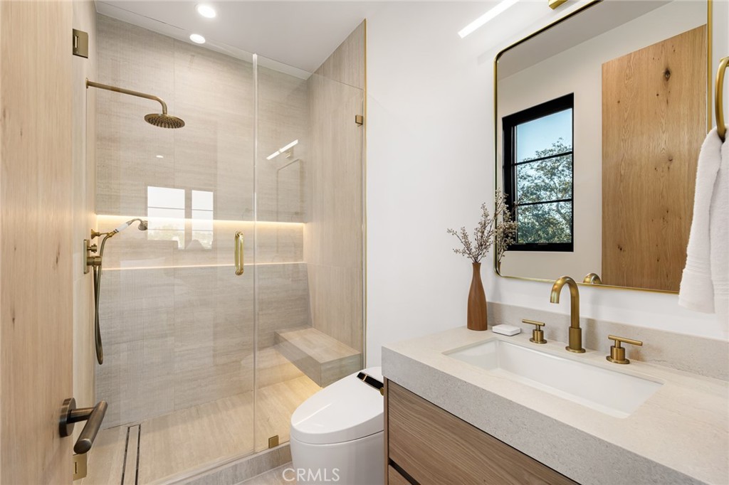 12249 Addison Street Valley Village, CA 91607 - Photo 45 of 60 a bathroom with a sink toilet and shower