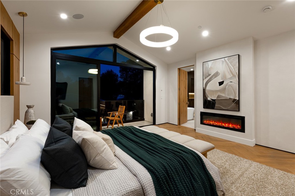 12249 Addison Street Valley Village, CA 91607 - Photo 46 of 60 a bedroom with a large bed and a large mirror