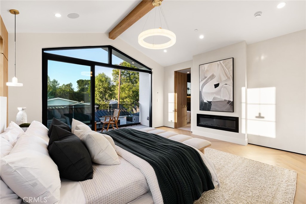 12249 Addison Street Valley Village, CA 91607 - Photo 47 of 60 a bedroom with a large bed and a large window