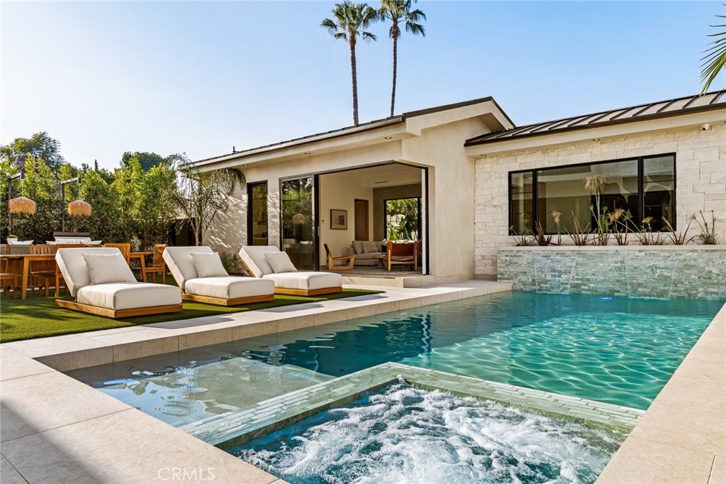12249 Addison Street Valley Village, CA 91607 - Photo 5 of 60 a view of a house with swimming pool and sitting area