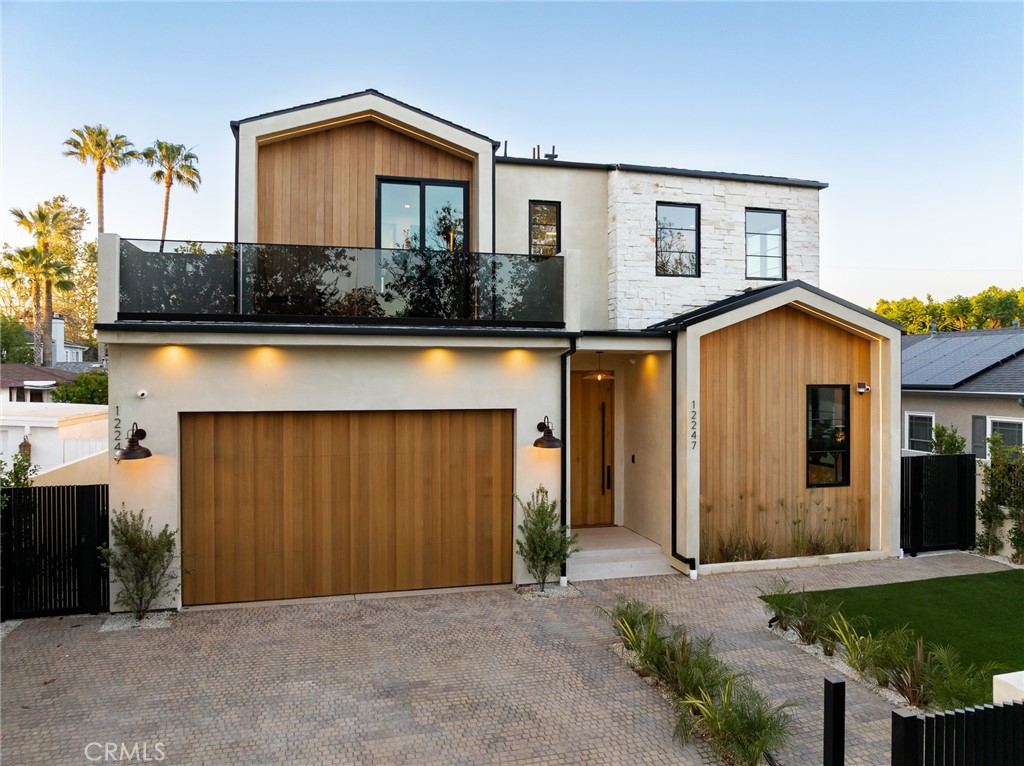 12249 Addison Street Valley Village, CA 91607 - Photo 7 of 60 a front view of a house with garden