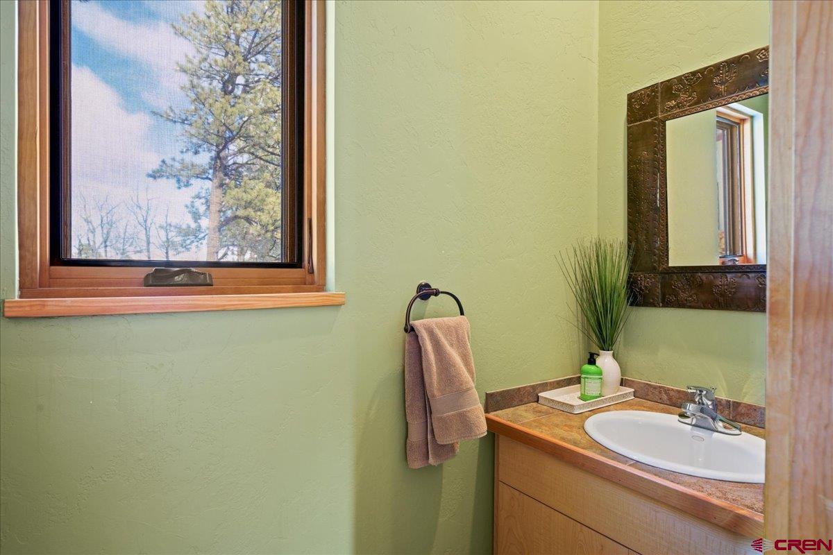 1578 Aspen Drive Ridgway, CO 81432 - Photo 31 of 45 a bathroom with a sink and a mirror