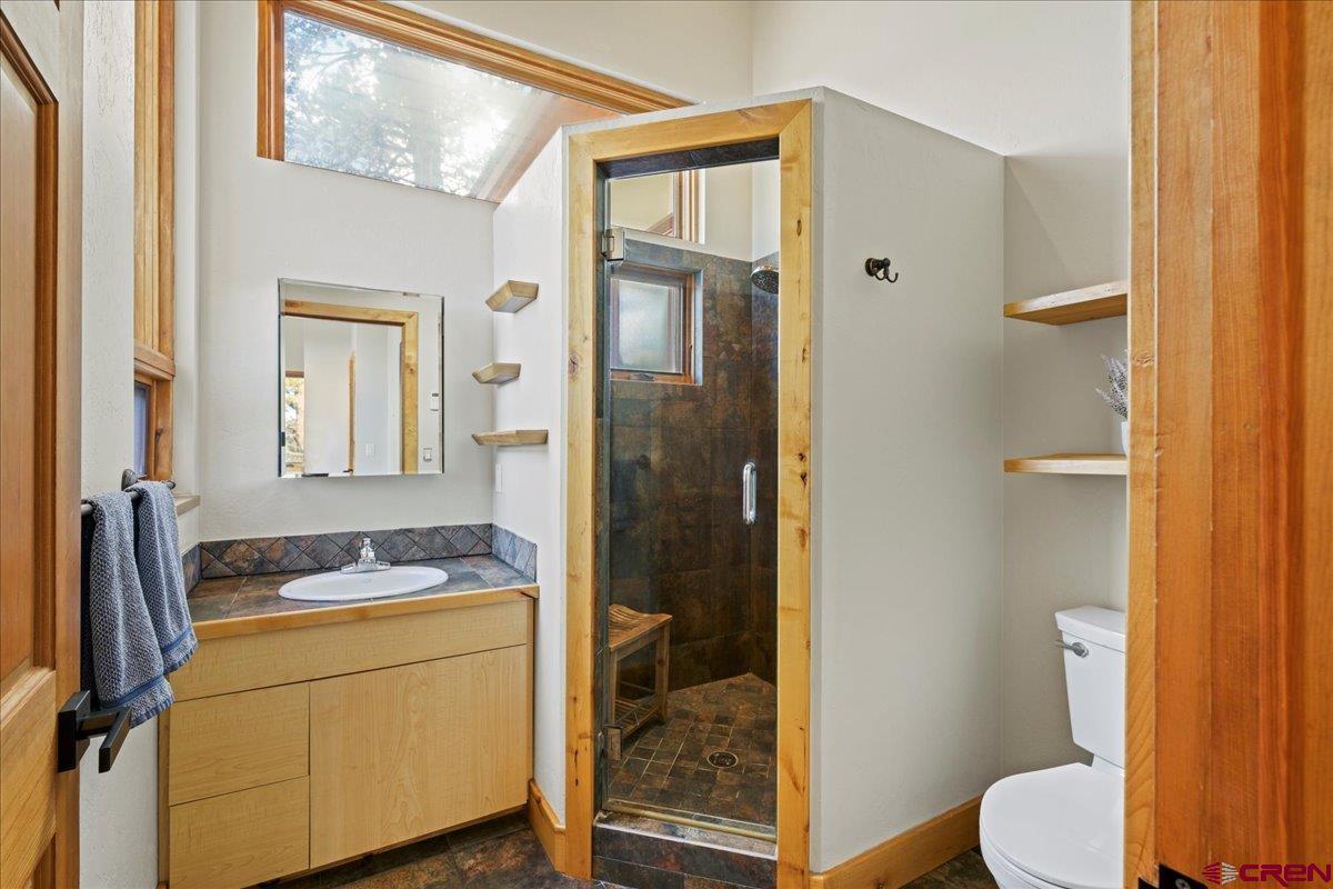 1578 Aspen Drive Ridgway, CO 81432 - Photo 39 of 45 a bathroom with a sink a toilet and shower