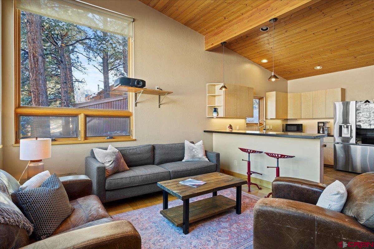 1578 Aspen Drive Ridgway, CO 81432 - Photo 6 of 45 a living room with furniture and a large window