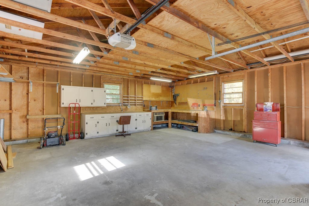 3204 West Weaver Road Hampton, VA 23666 - Photo 27 of 27 Garage with a workshop area and a garage door opener