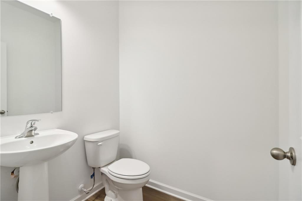 2115 Boxwood Circle Conyers, GA 30013 - Photo 14 of 42 a bathroom with a sink and a toilet