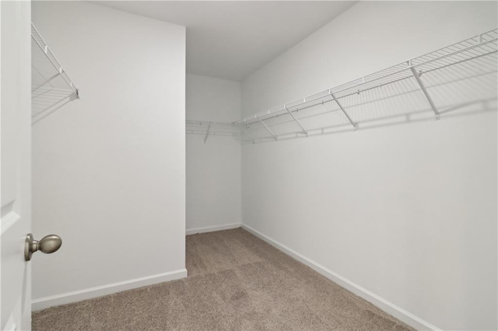 2115 Boxwood Circle Conyers, GA 30013 - Photo 21 of 42 a view of a room with racks on the wall