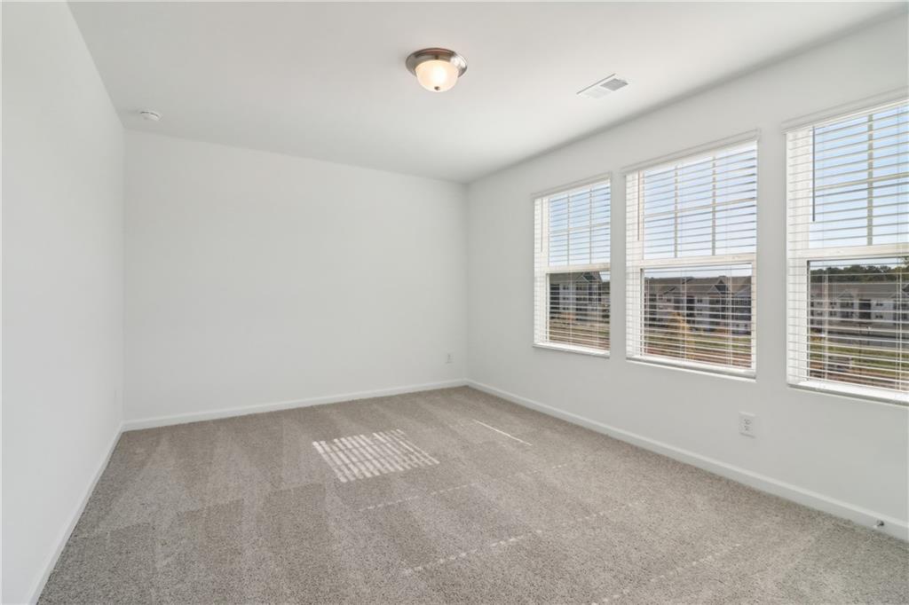 2115 Boxwood Circle Conyers, GA 30013 - Photo 22 of 42 an empty room with a window