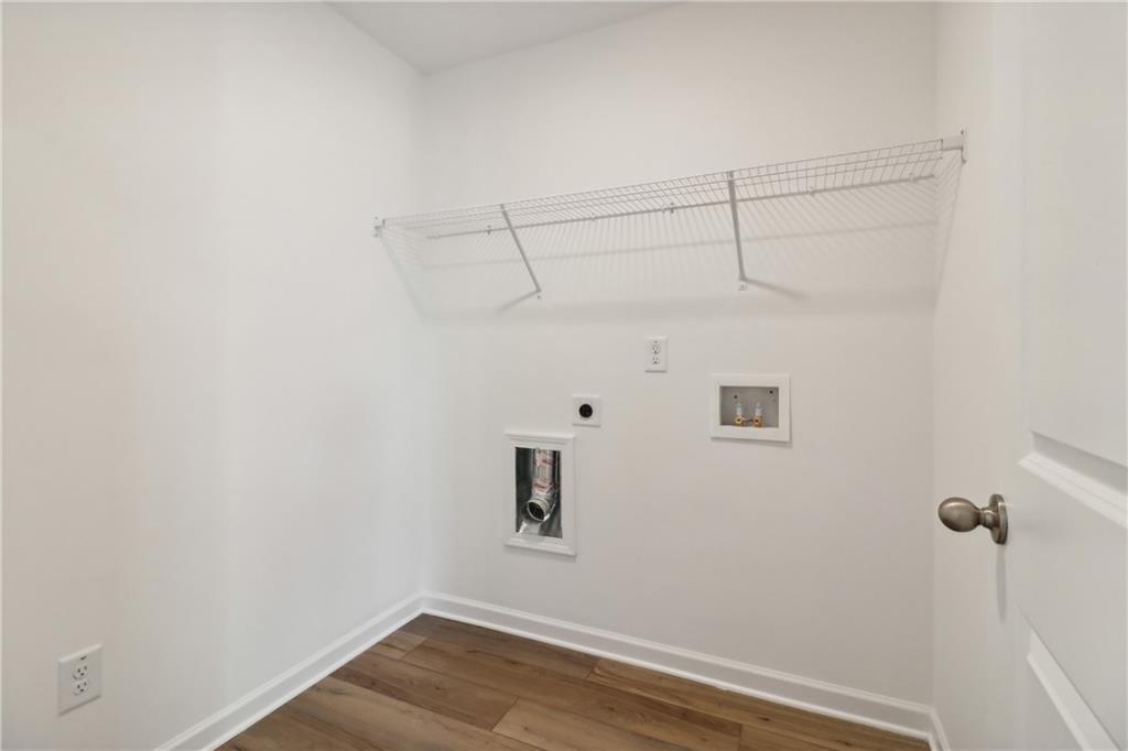 2115 Boxwood Circle Conyers, GA 30013 - Photo 23 of 42 a view of a room with racks on the wall