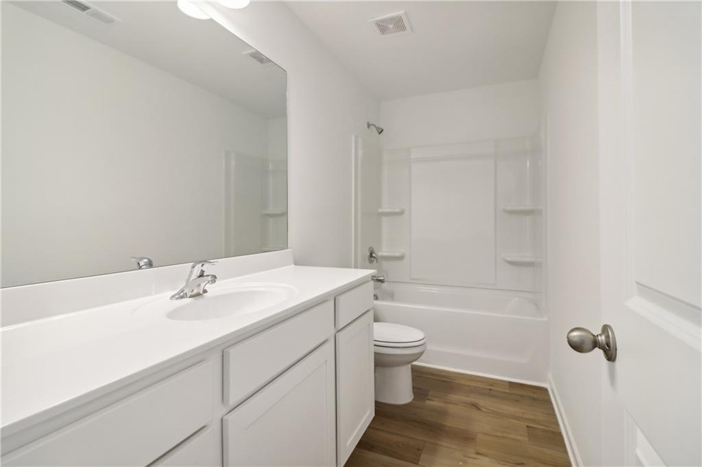 2115 Boxwood Circle Conyers, GA 30013 - Photo 24 of 42 a bathroom with a sink a toilet and shower