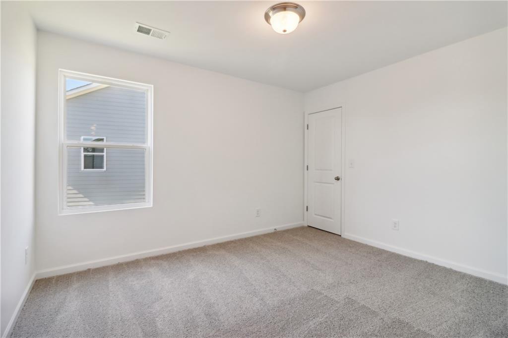 2115 Boxwood Circle Conyers, GA 30013 - Photo 25 of 42 an empty room with a window