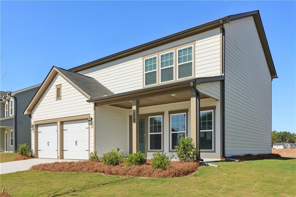 2115 Boxwood Circle Conyers, GA 30013 - Photo 3 of 42 front view of a house with a yard