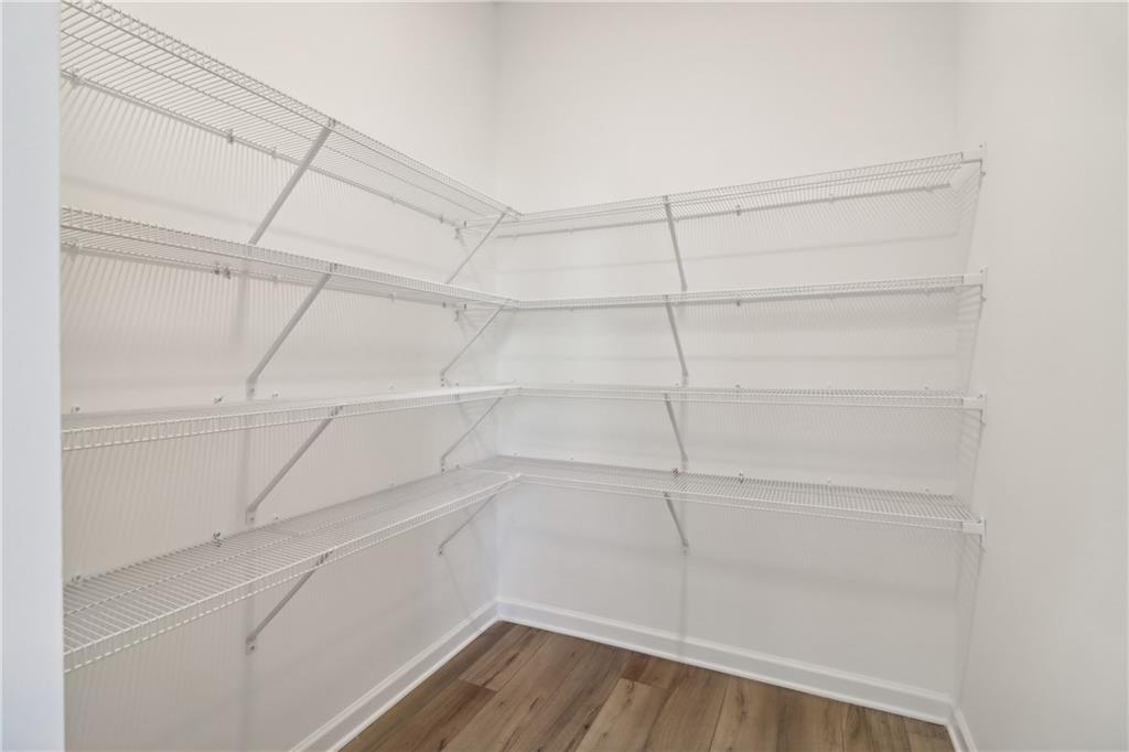 2115 Boxwood Circle Conyers, GA 30013 - Photo 10 of 42 a view of a room with racks on the wall