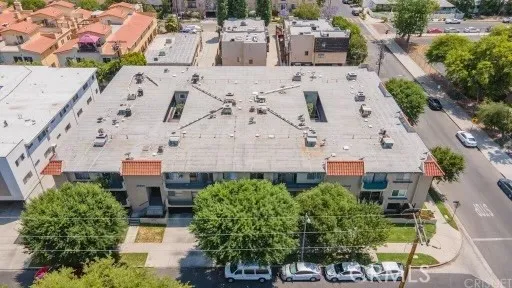an aerial view of a house with a yard
