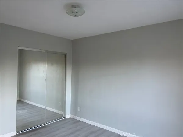 an empty room with wooden floor