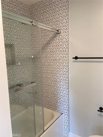 a bathroom with a shower and a bathtub