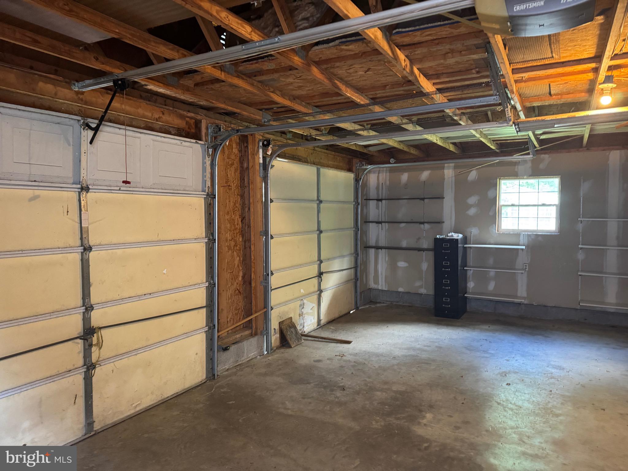 304 Cool Hollow Road Falling Waters, WV 25419 - Photo 11 of 42 a view of a garage room with washing machine