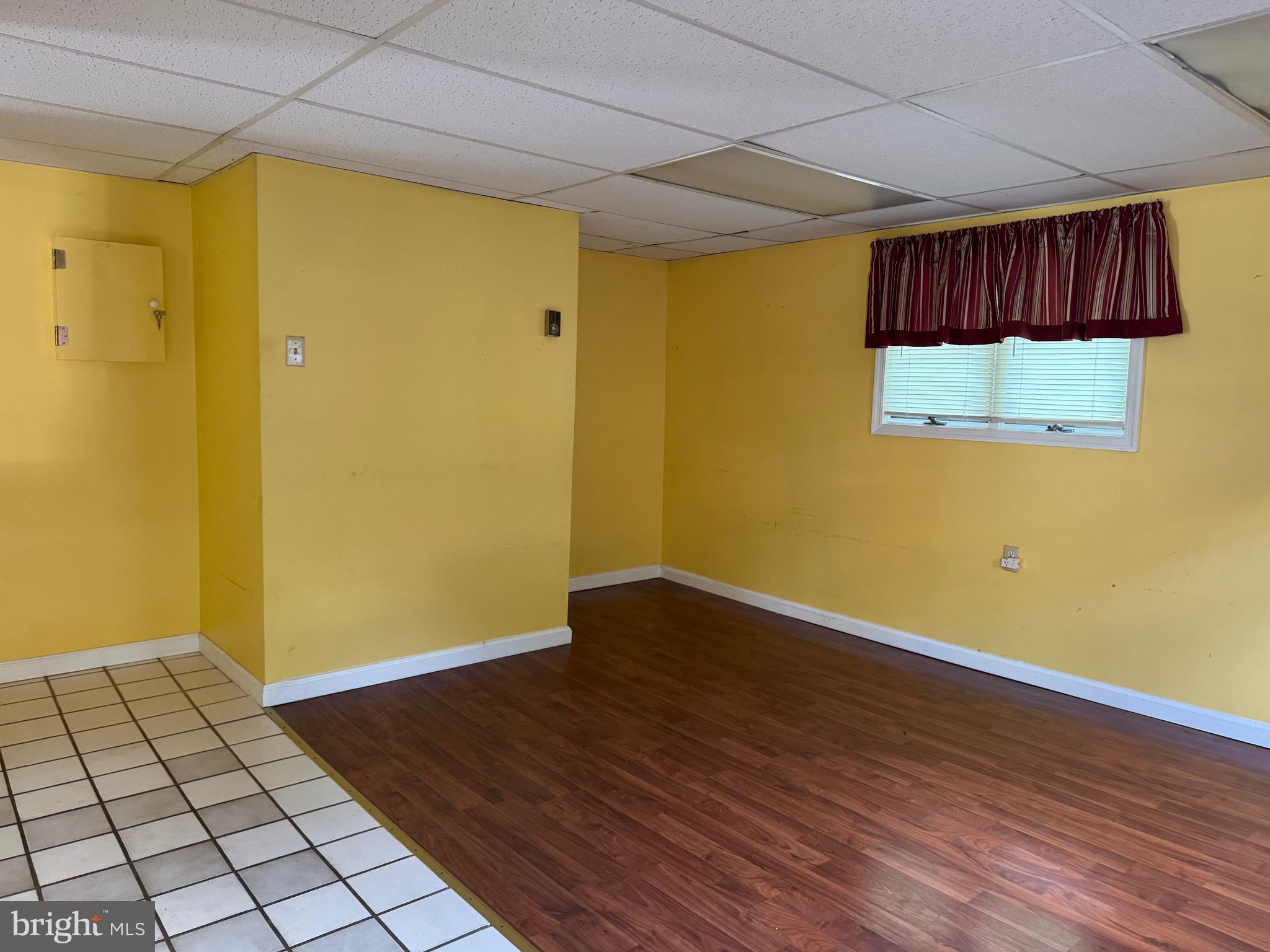 304 Cool Hollow Road Falling Waters, WV 25419 - Photo 17 of 42 a view of an empty room with wooden floor and a window