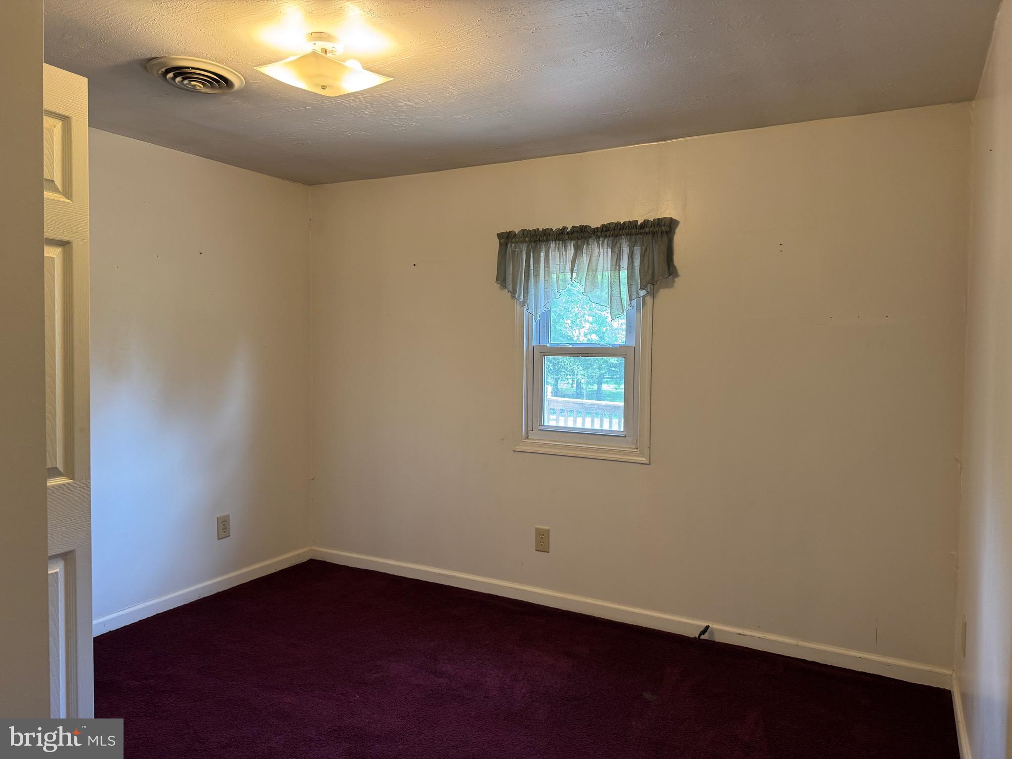 304 Cool Hollow Road Falling Waters, WV 25419 - Photo 25 of 42 an empty room with a empty space and a window