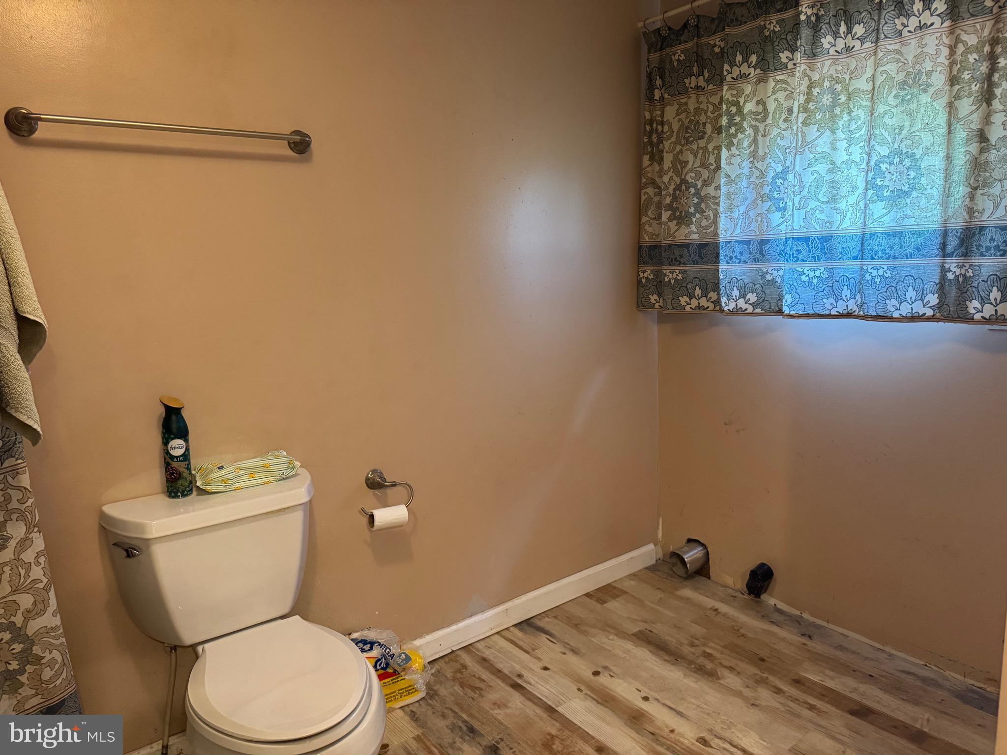 304 Cool Hollow Road Falling Waters, WV 25419 - Photo 30 of 42 a white toilet sitting next to a shower curtain