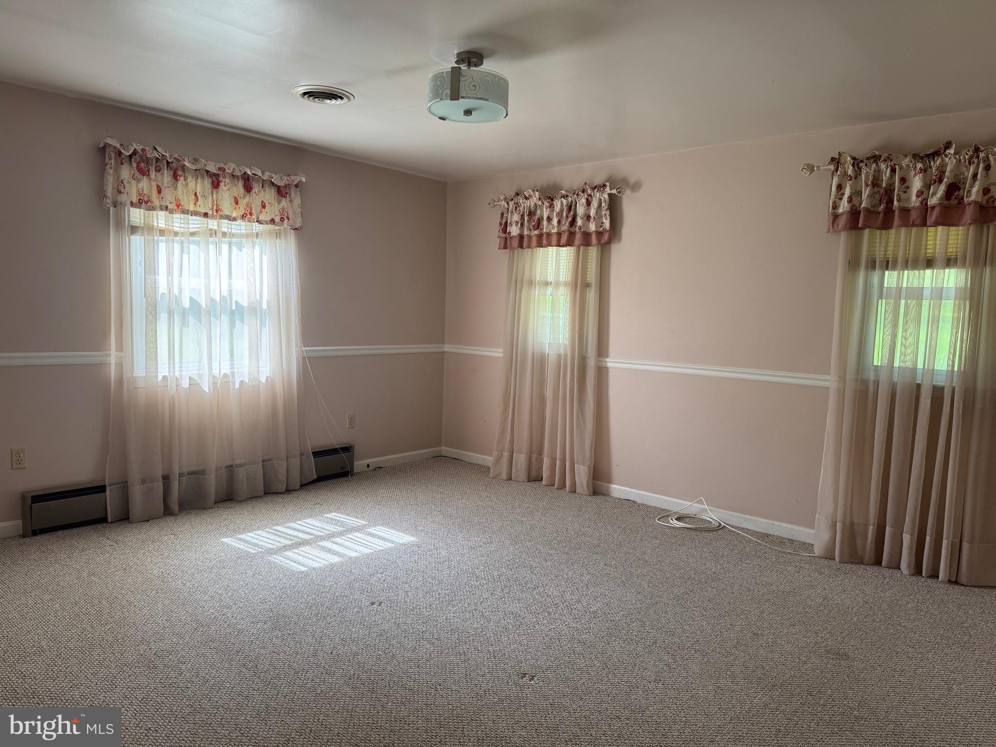 304 Cool Hollow Road Falling Waters, WV 25419 - Photo 36 of 42 an empty room with windows
