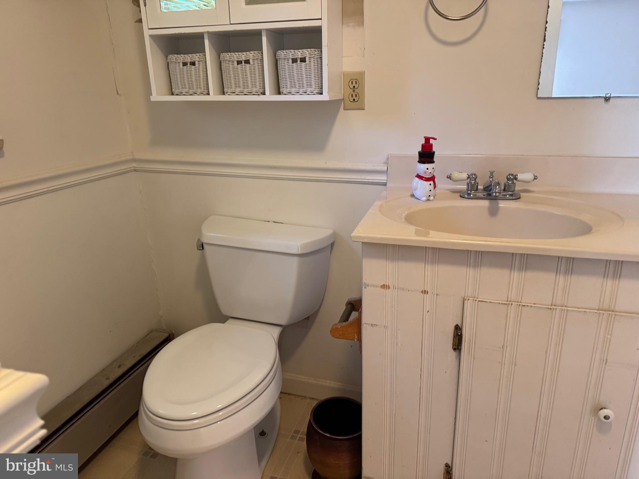 304 Cool Hollow Road Falling Waters, WV 25419 - Photo 40 of 42 a bathroom with a sink a toilet and a mirror