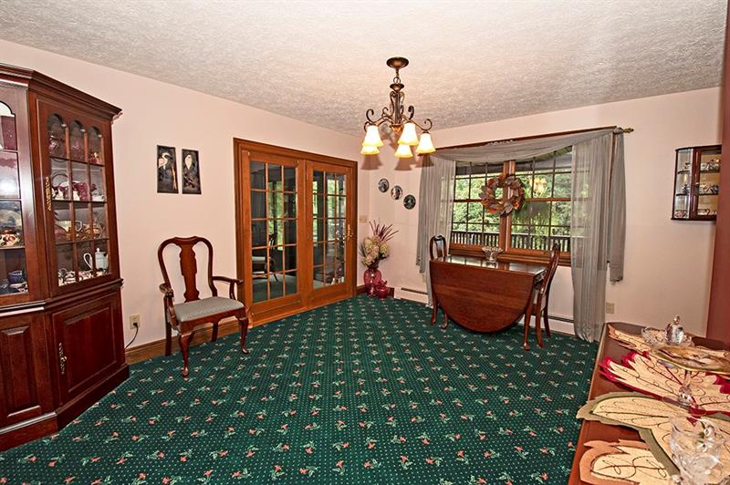 56 Creek Road Sandy Lake, PA 16145 - Photo 7 of 24 Dining Room with oak floors,sliding door to sun porch.